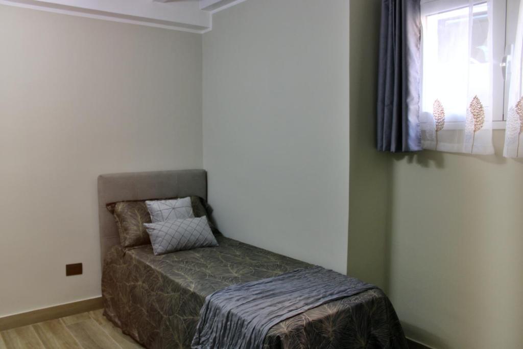 Postel nebo postele na pokoji v ubytování Keope Urban Suite