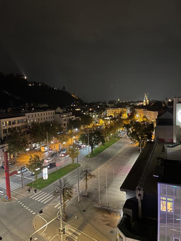 a night view of a city with a parking lot at Zentrale Wohnung in Graz SOVA 2 in Graz