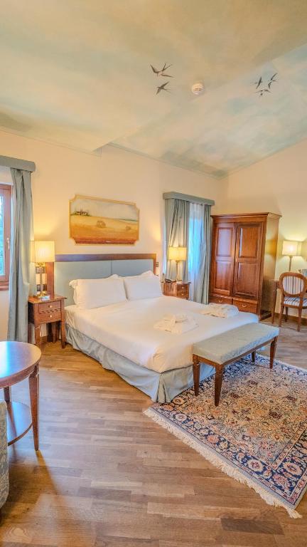 Postel nebo postele na pokoji v ubytování Relais Corte Cavalli