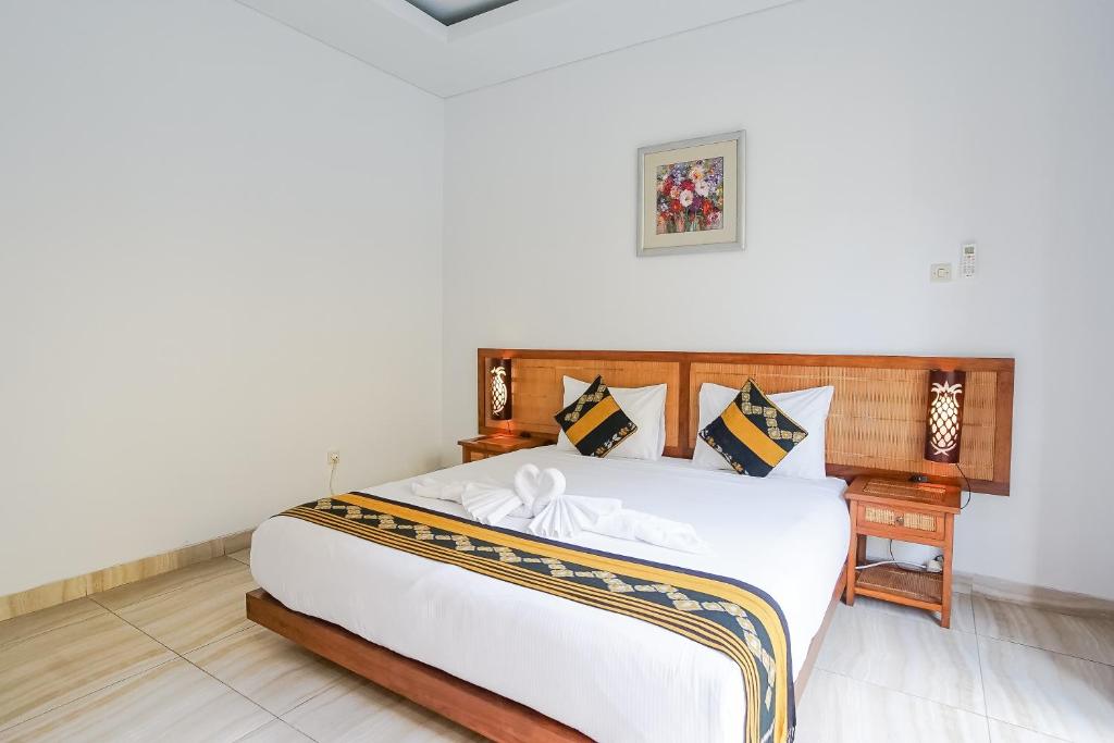 Postel nebo postele na pokoji v ubytování Toya Villa Ubud