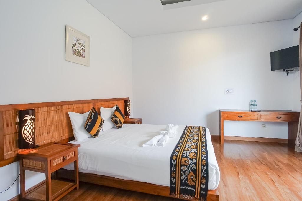 Postel nebo postele na pokoji v ubytování Toya Villa Ubud