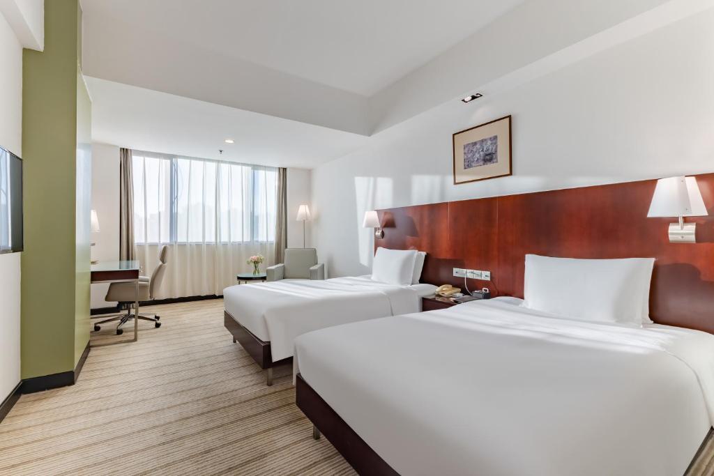 Postel nebo postele na pokoji v ubytování Holiday Inn Shanghai Vista by IHG - Easy access to travel spot city walk