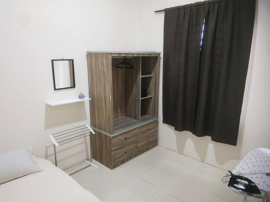 Postel nebo postele na pokoji v ubytování Setia Homestay Chemor Setia