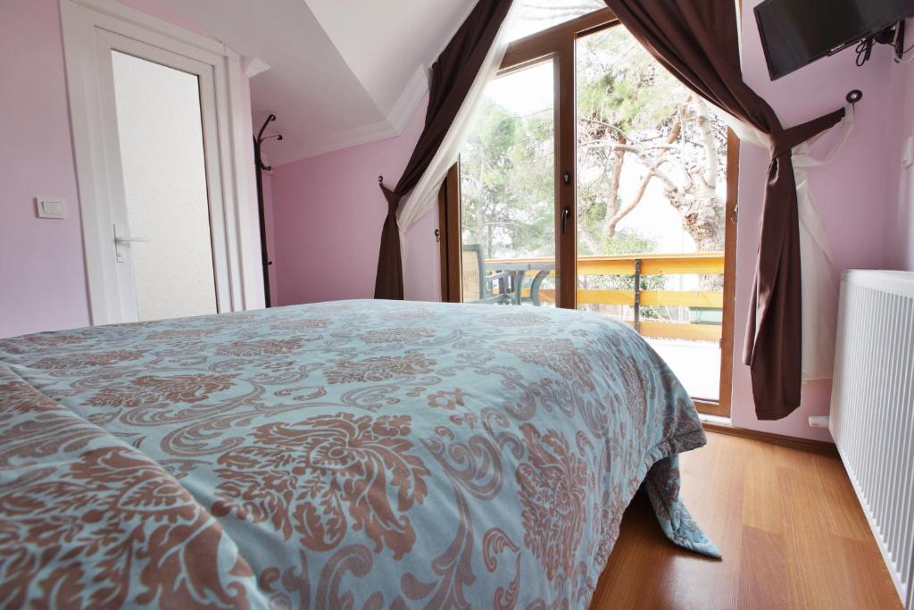 Postel nebo postele na pokoji v ubytování Nizam Butik Otel Büyükada