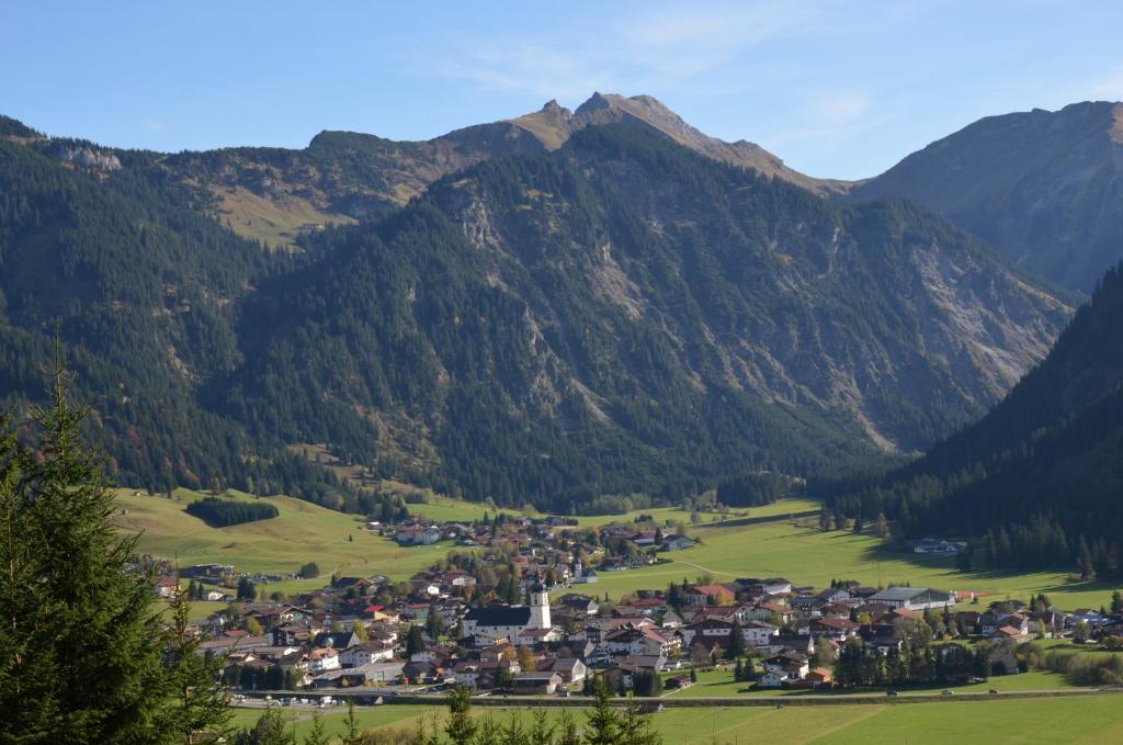 a small town in a valley in the mountains at Haus Sennweg in Tannheim