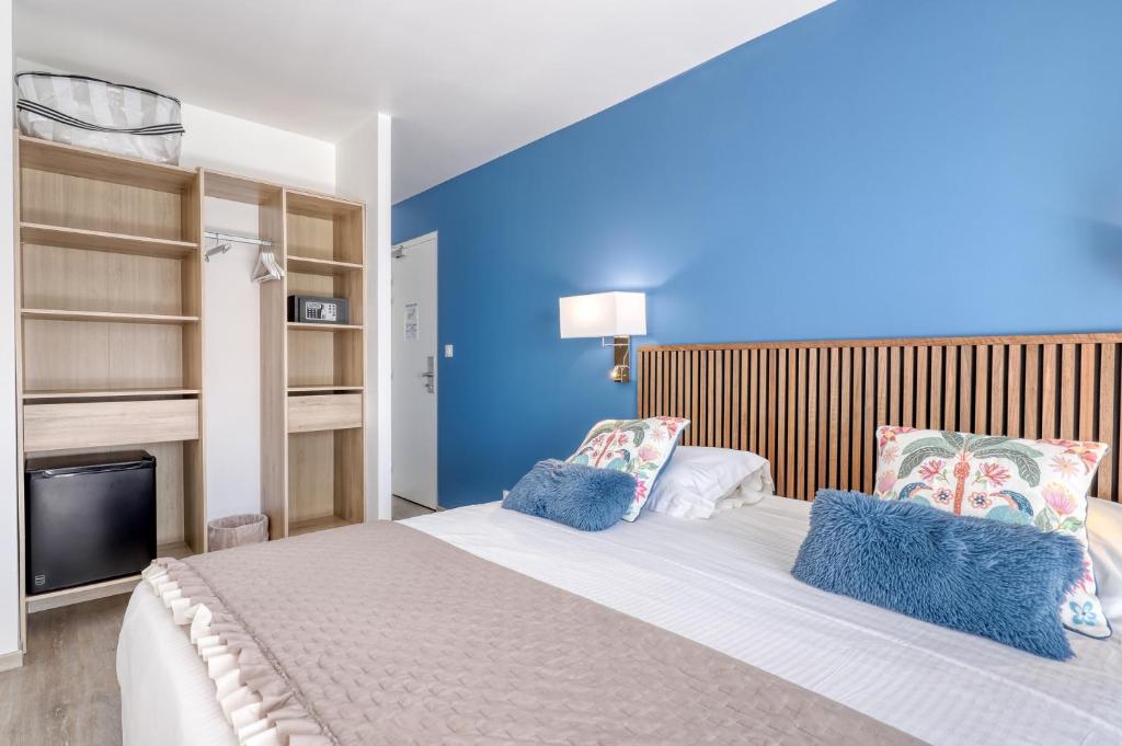 Postel nebo postele na pokoji v ubytování Anglade Hotel