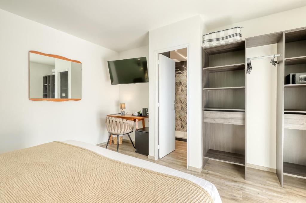 Postel nebo postele na pokoji v ubytování Anglade Hotel