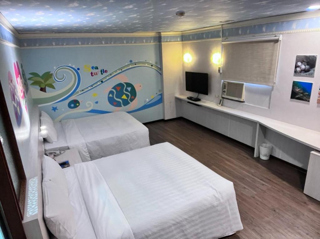 TV a/nebo společenská místnost v ubytování Tapeng Bay Holiday Hotel