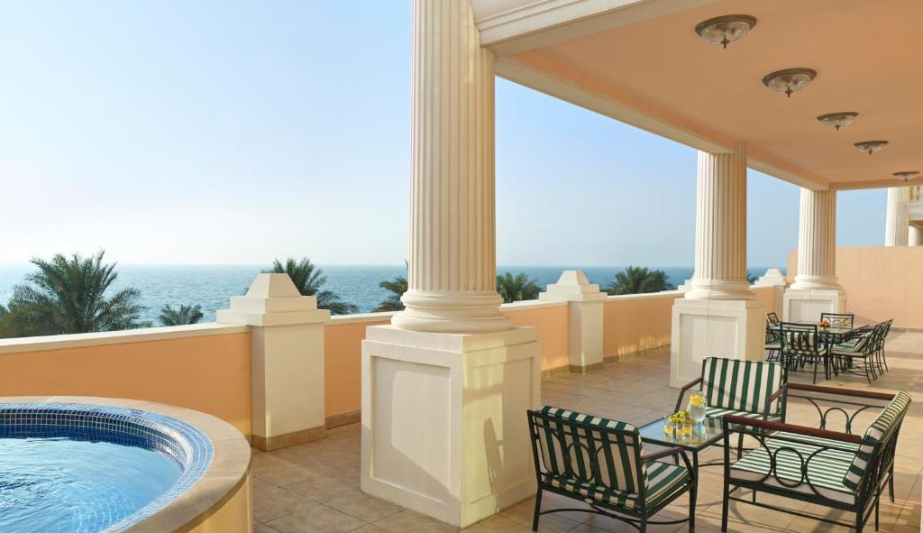 a hot tub on the balcony of a resort at Kempinski Hotel Palm Jumeirah in Dubai