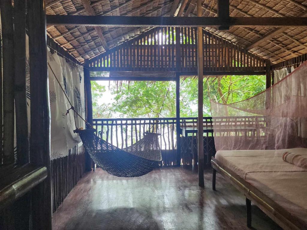 Postel nebo postele na pokoji v ubytování Bice Camp Darocotan
