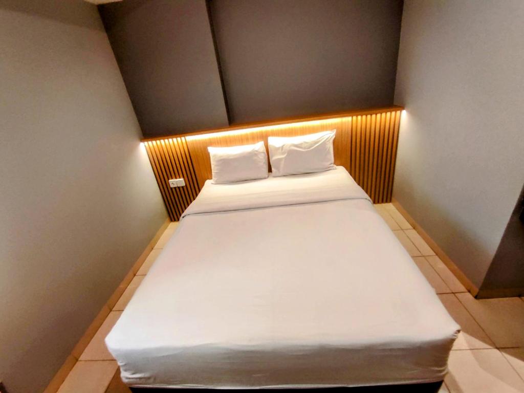 Voodi või voodid majutusasutuse Studio One Thamrin Hotel toas