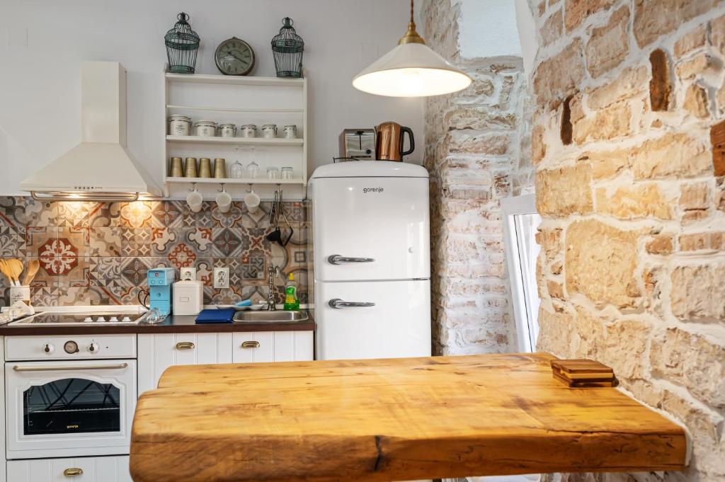 Kuchnia lub aneks kuchenny w obiekcie Apartman tutto bene