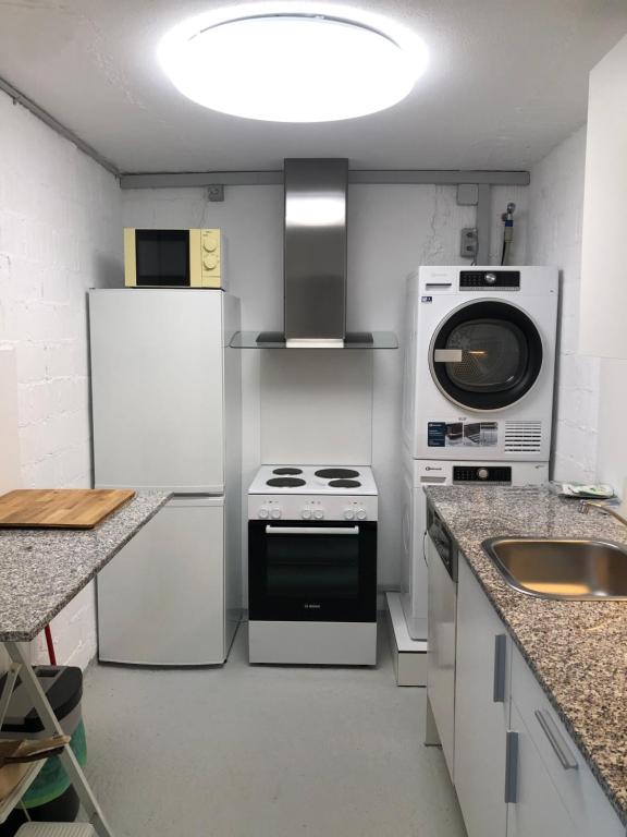 Kuchyň nebo kuchyňský kout v ubytování W22 Thunersee