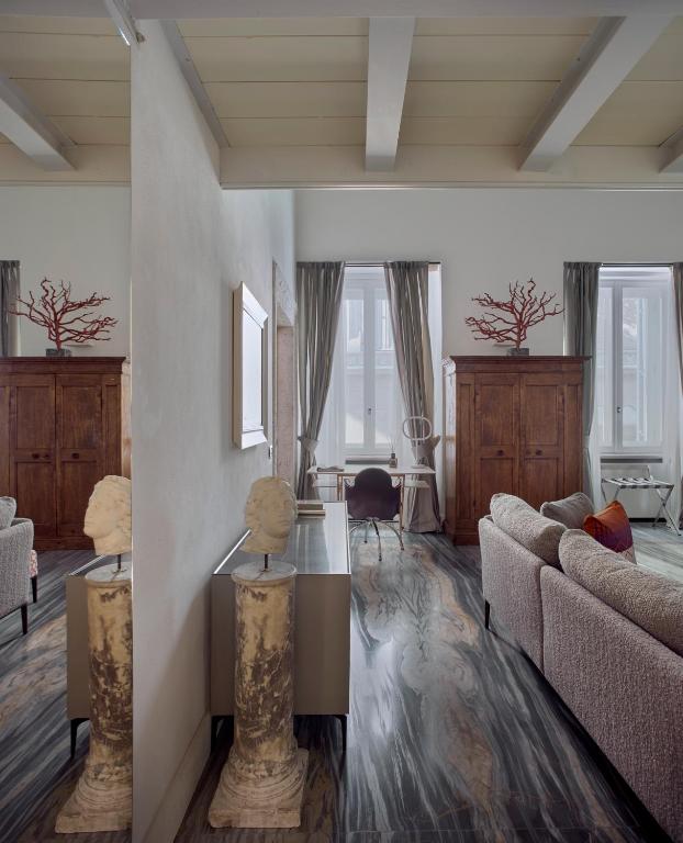 A seating area at Palazzo Delle Pietre - Luxury Apartments