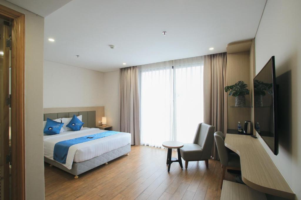 Giường trong phòng chung tại Elite Hotel Nha Trang