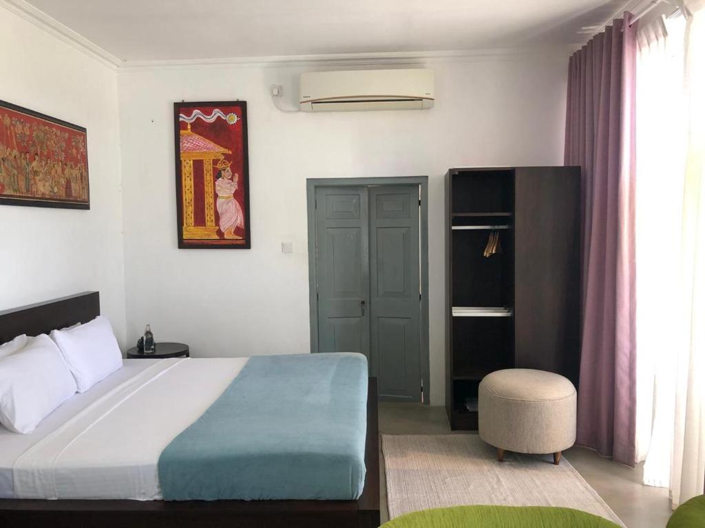 Postel nebo postele na pokoji v ubytování Angam Villas Colombo