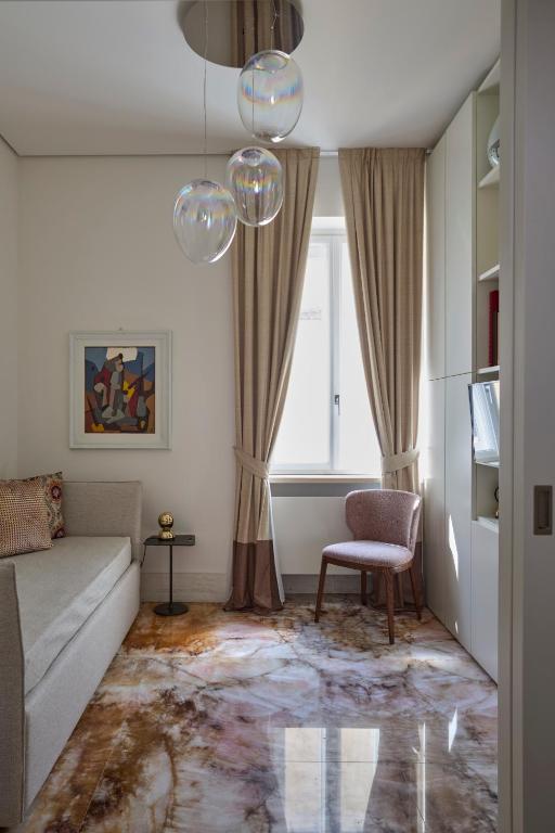 A bed or beds in a room at Palazzo Delle Pietre - Luxury Apartments