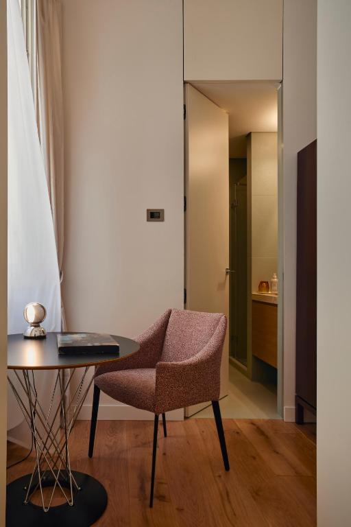A seating area at Palazzo Delle Pietre - Luxury Apartments