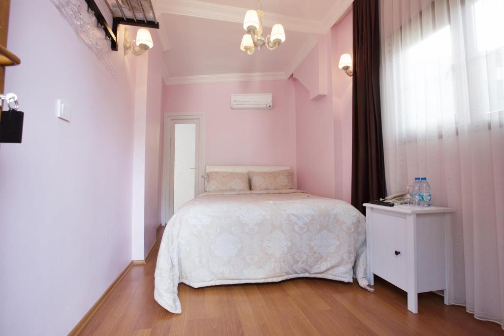 Postel nebo postele na pokoji v ubytování Nizam Butik Otel Büyükada