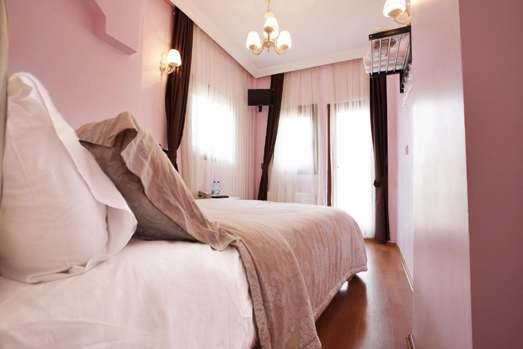 Postel nebo postele na pokoji v ubytování Nizam Butik Otel Büyükada