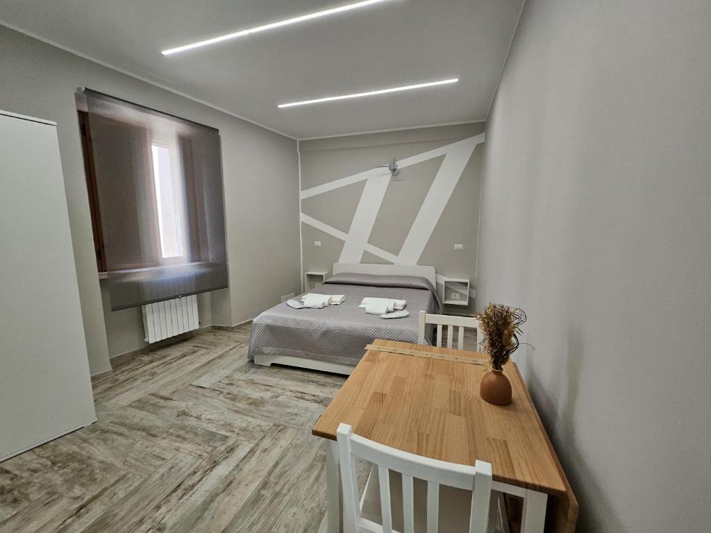 Postel nebo postele na pokoji v ubytování Le Stanze di Giulia