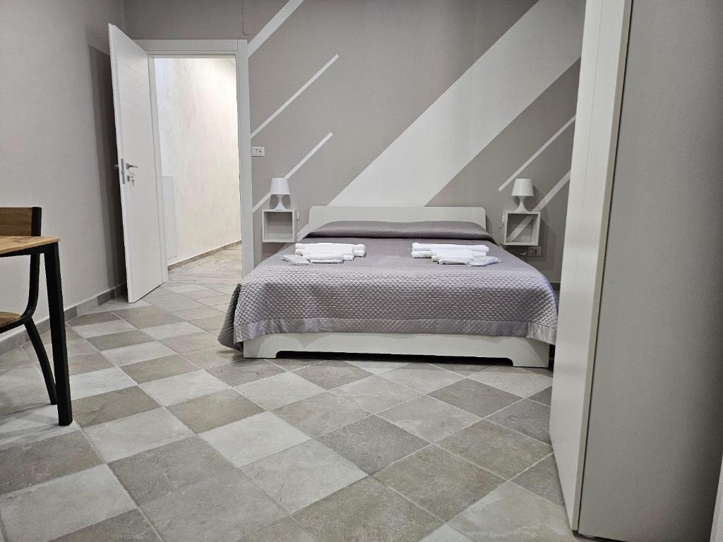 Postel nebo postele na pokoji v ubytování Le Stanze di Giulia