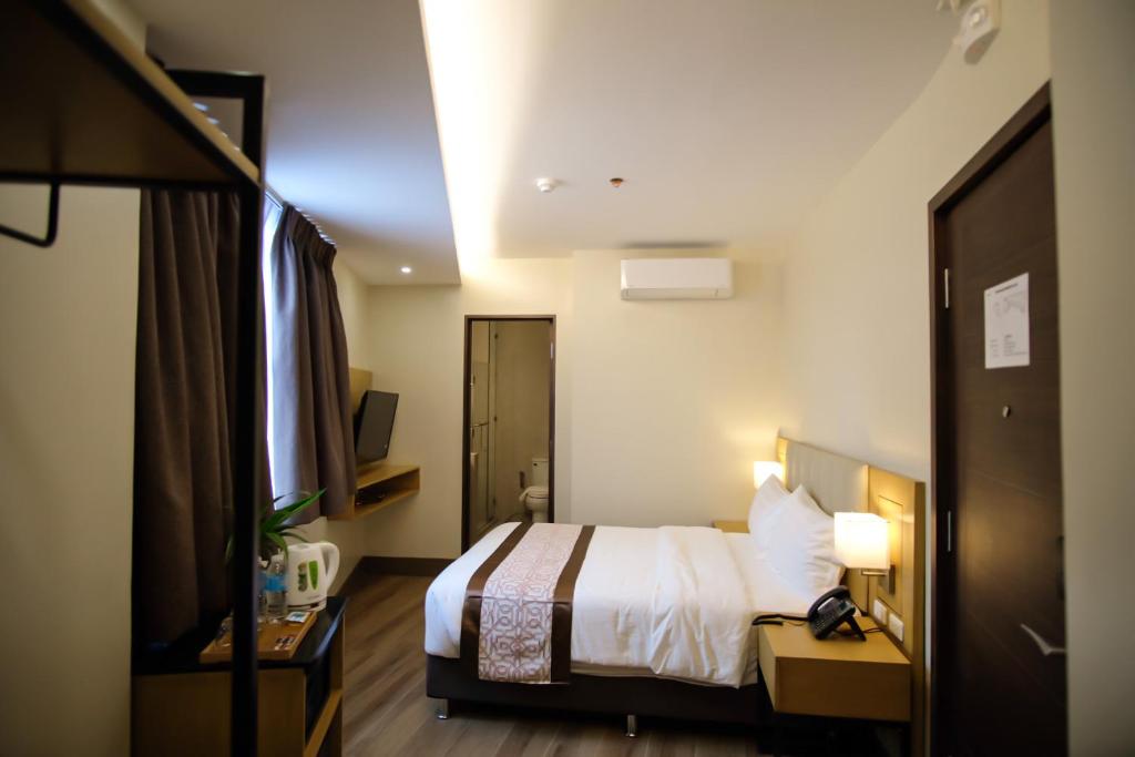 Postel nebo postele na pokoji v ubytování Citi Park Hotel Cebu powered by Cocotel