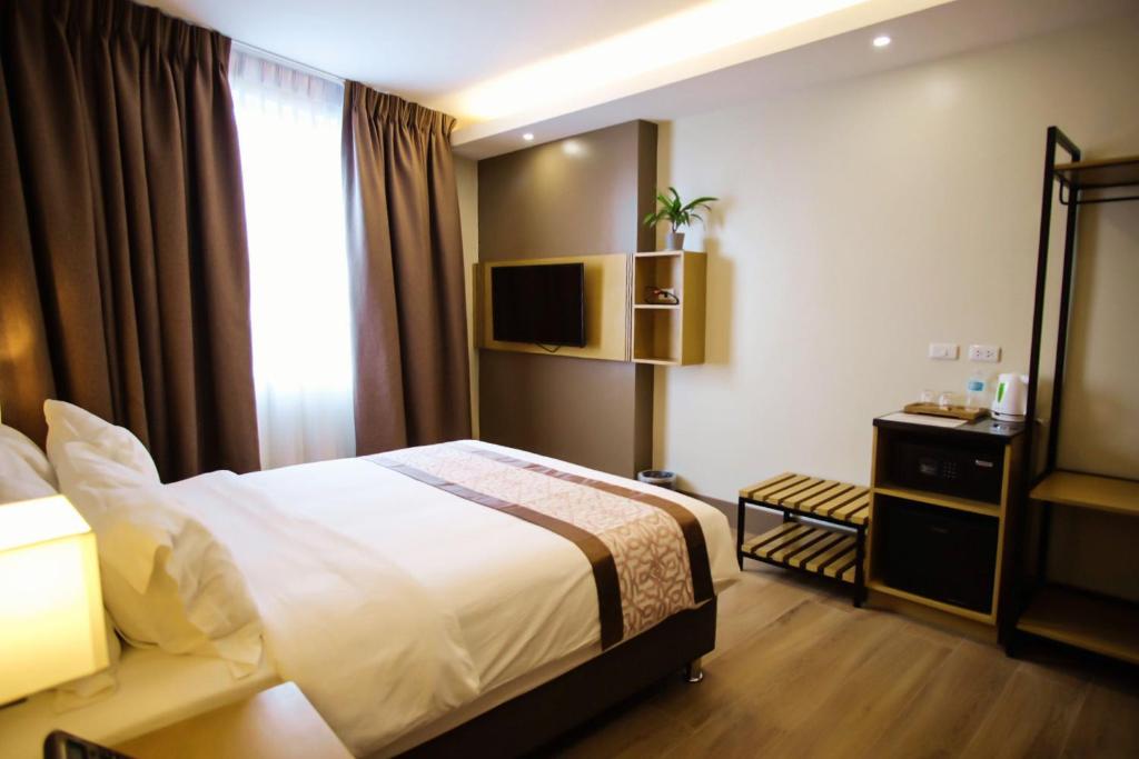 Postel nebo postele na pokoji v ubytování Citi Park Hotel Cebu powered by Cocotel