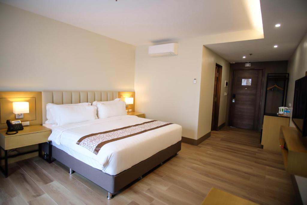 Postel nebo postele na pokoji v ubytování Citi Park Hotel Cebu powered by Cocotel