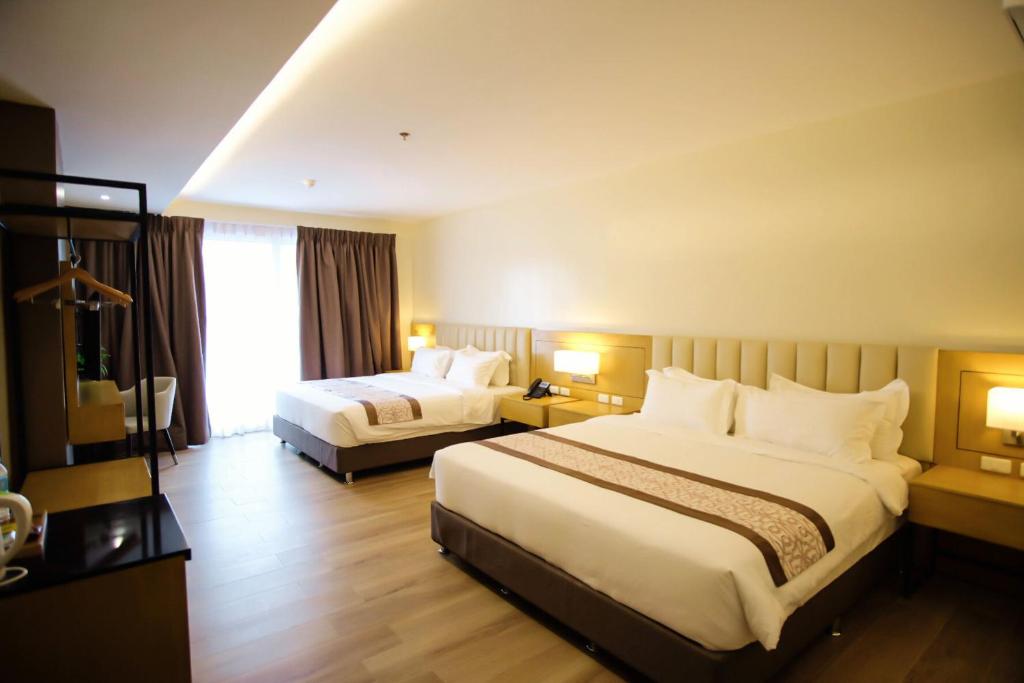 Postel nebo postele na pokoji v ubytování Citi Park Hotel Cebu powered by Cocotel