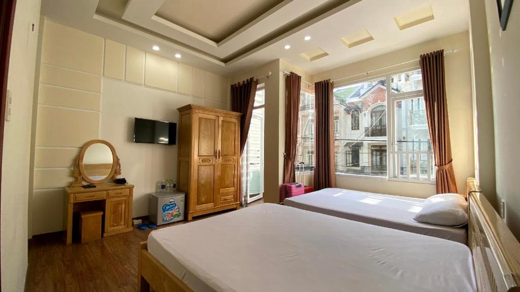 Postel nebo postele na pokoji v ubytování Thảo Nguyên