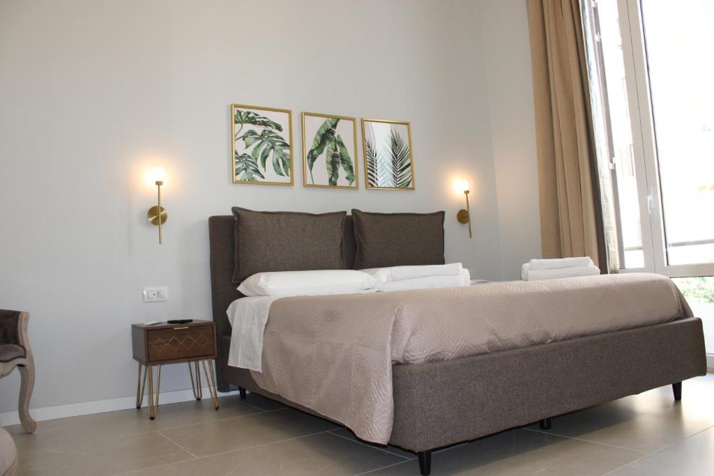 Postel nebo postele na pokoji v ubytování InCentro Elegant Rooms