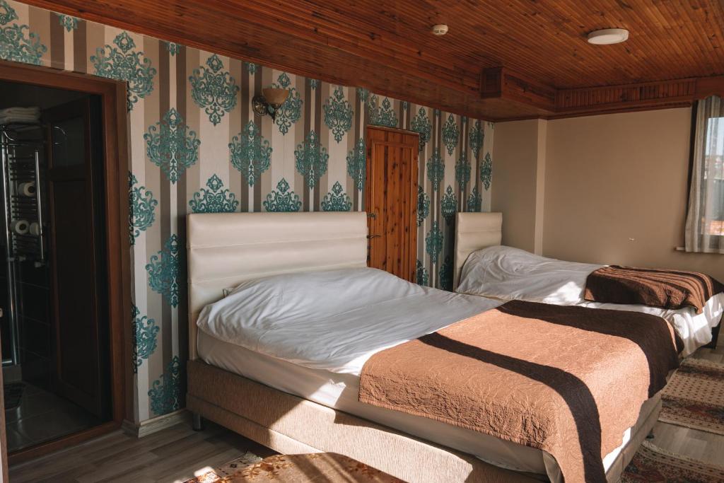 Katil atau katil-katil dalam bilik di Green Life Apart Hotel