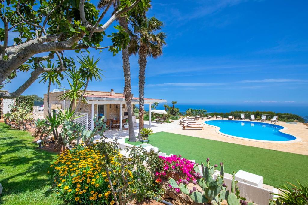 a villa with a garden and a swimming pool at Villa Tenuta Ai Fichi con piscina esclusiva in Leuca