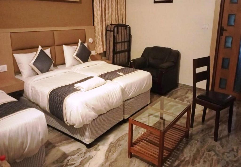 Postel nebo postele na pokoji v ubytování Nestlay Rooms Ambattur