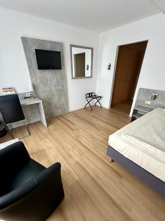 TV a/nebo společenská místnost v ubytování Asgard Hotel