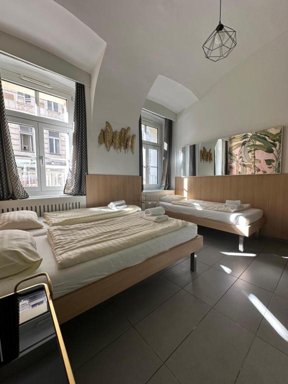 Postel nebo postele na pokoji v ubytování HousingPlus