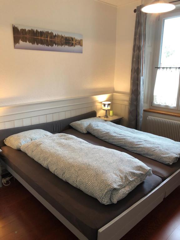 Postel nebo postele na pokoji v ubytování Le Houx