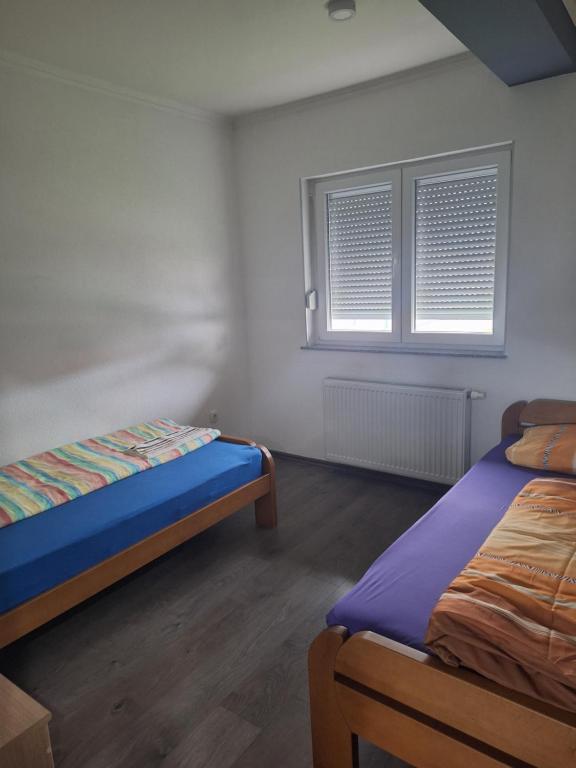 Postel nebo postele na pokoji v ubytování Apartman Knežević