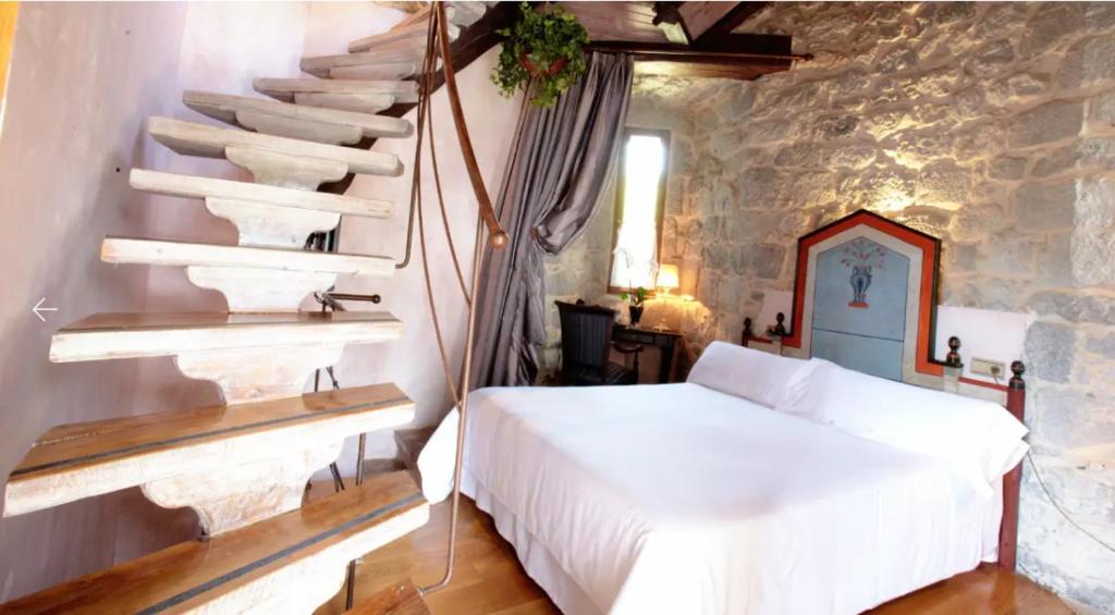 Cama o camas de una habitación en Hotel Castillo de Arteaga