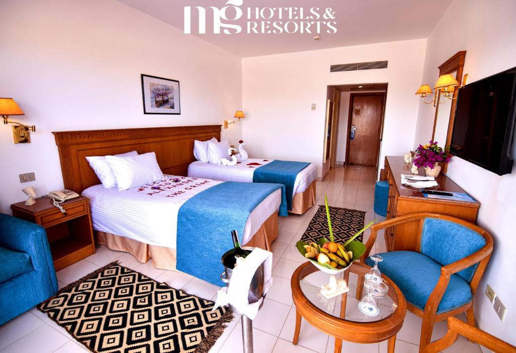 Postel nebo postele na pokoji v ubytování MG Alexander The Great Hotel