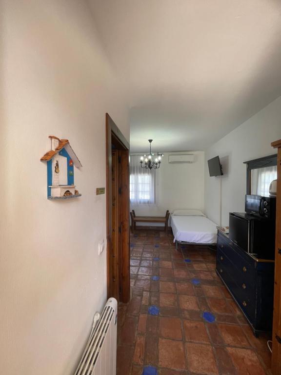 Postel nebo postele na pokoji v ubytování La Hacienda del Marquesado