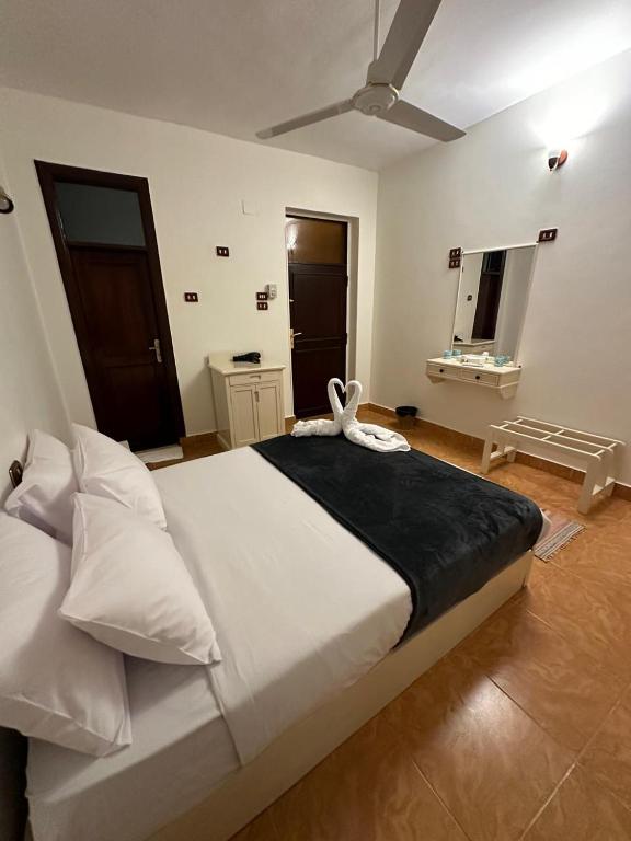A bed or beds in a room at Matager Guesthouse