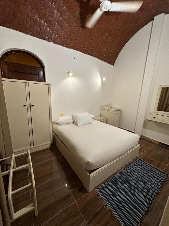 A bed or beds in a room at Matager Guesthouse