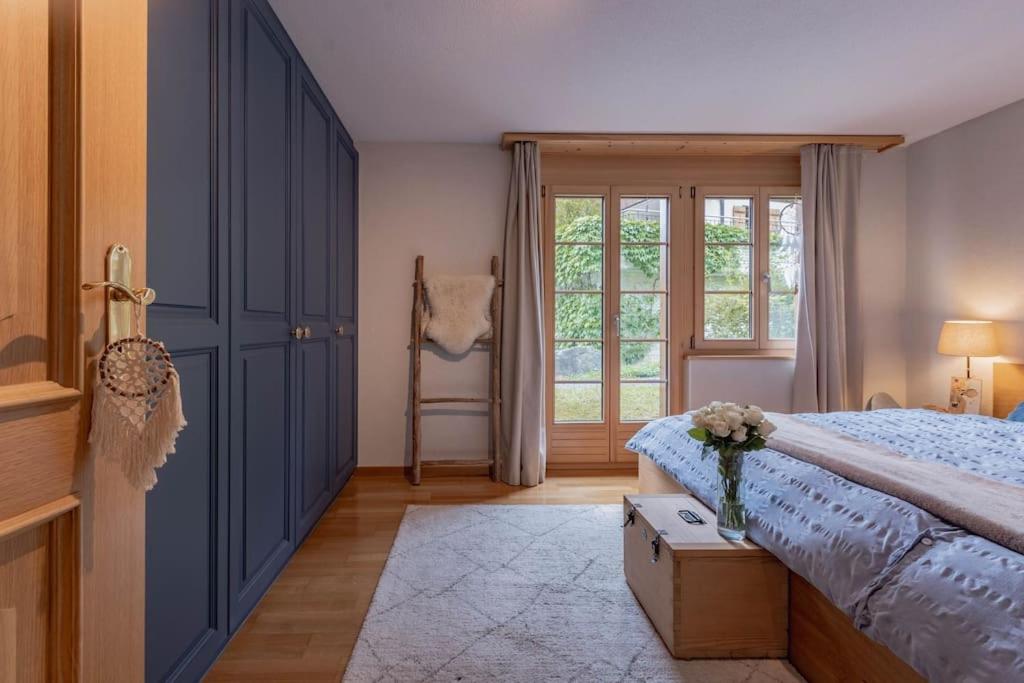 Postel nebo postele na pokoji v ubytování Wohnung Homely - Nähe Grindelwald Terminal