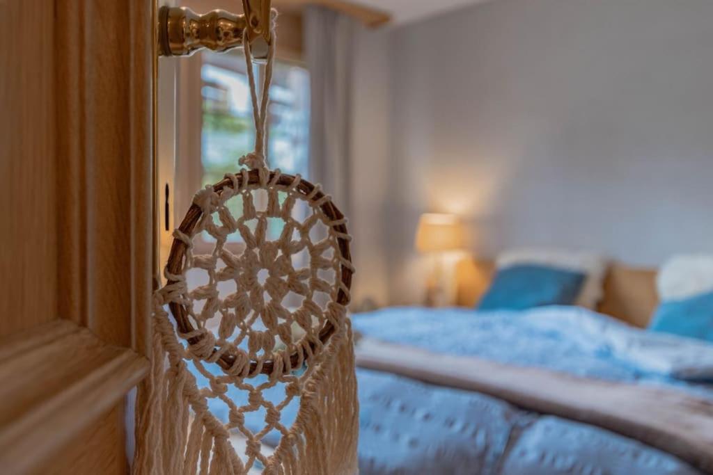 Postel nebo postele na pokoji v ubytování Wohnung Homely - Nähe Grindelwald Terminal