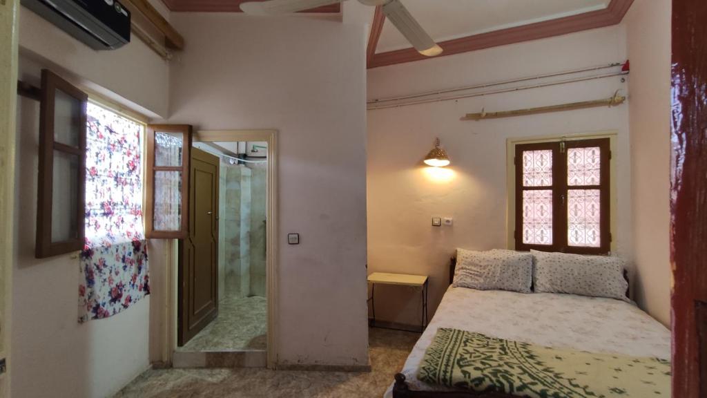 Postel nebo postele na pokoji v ubytování Hotel Oasis Tinghir