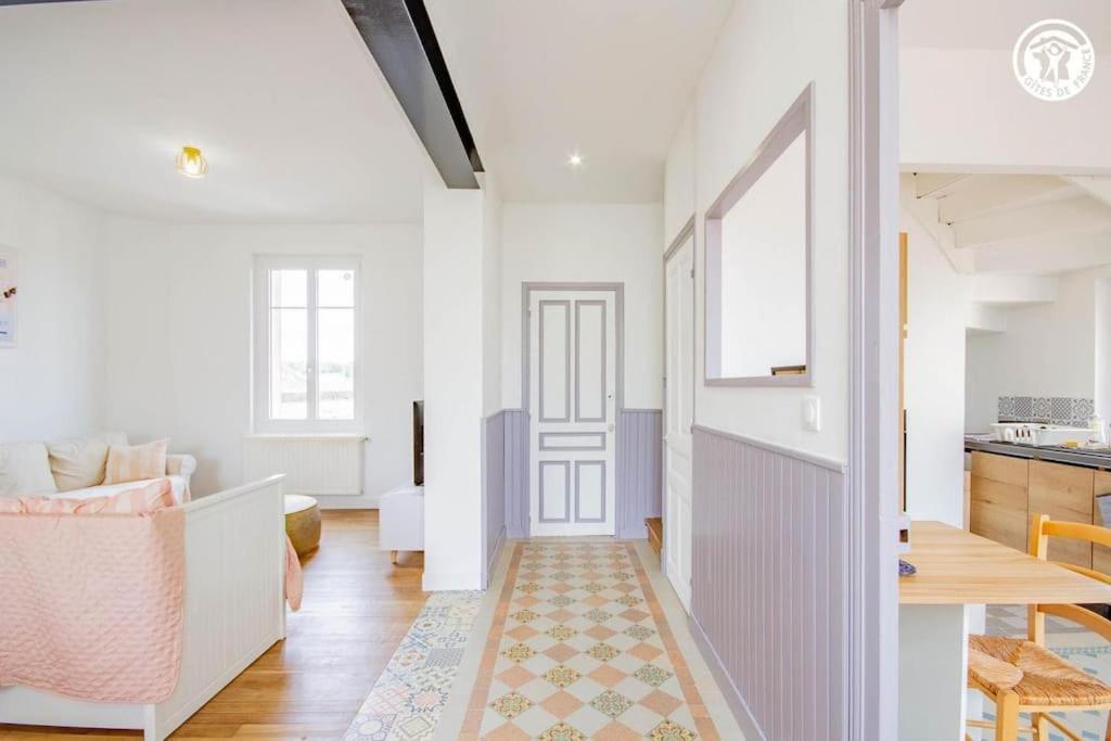 a hallway with a door and a living room at L'Albatros, Villa de charme familiale classée 3 étoiles, All inclusive in Paray-le-Monial