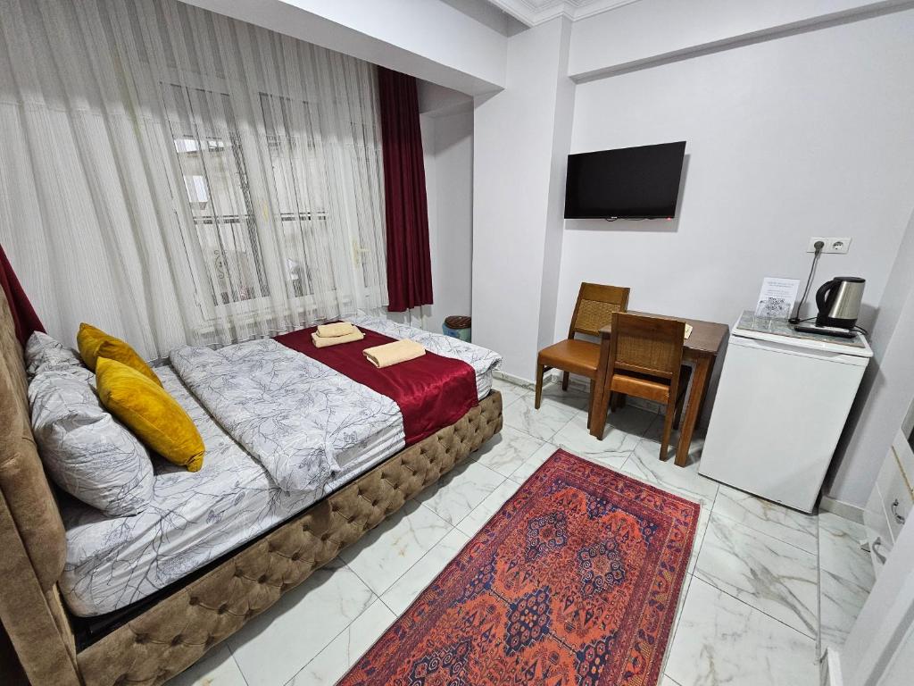 Postel nebo postele na pokoji v ubytování Pembe Hotel