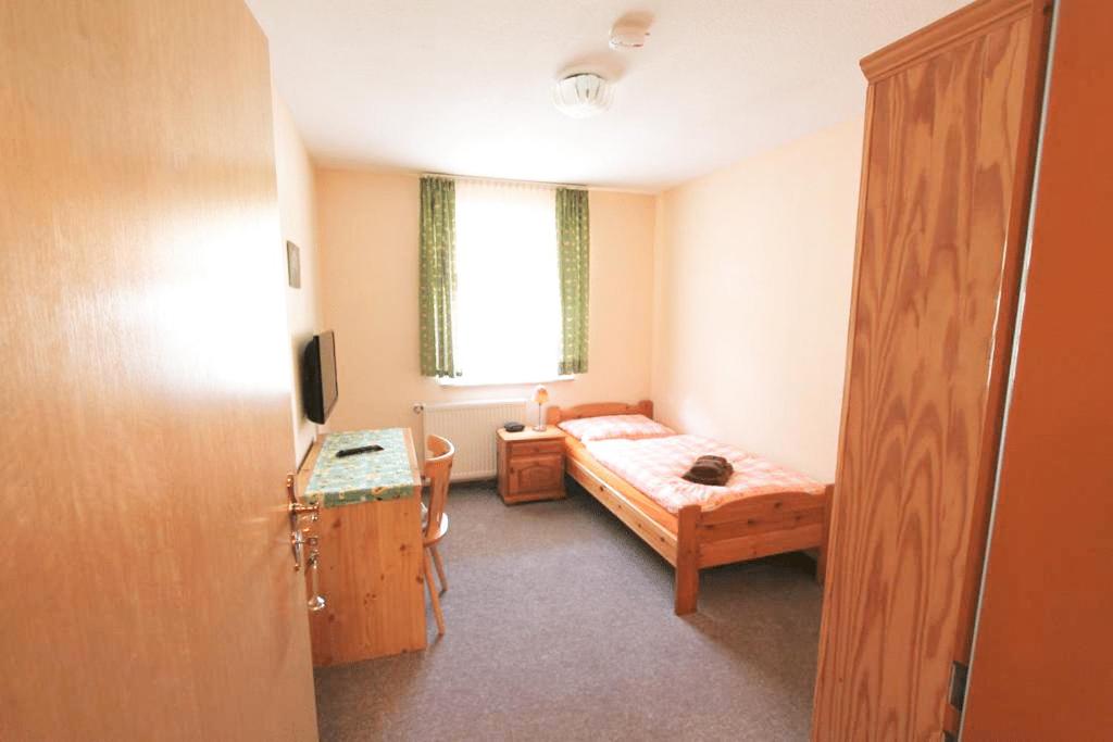 Postel nebo postele na pokoji v ubytování Gutsherrn Klause Dankerode